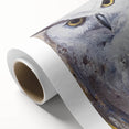 Rolled canvas artwork showcasing a stunning owl design in vibrant colors, ideal for home decor, packaged securely in a cardboard tube for safe delivery.