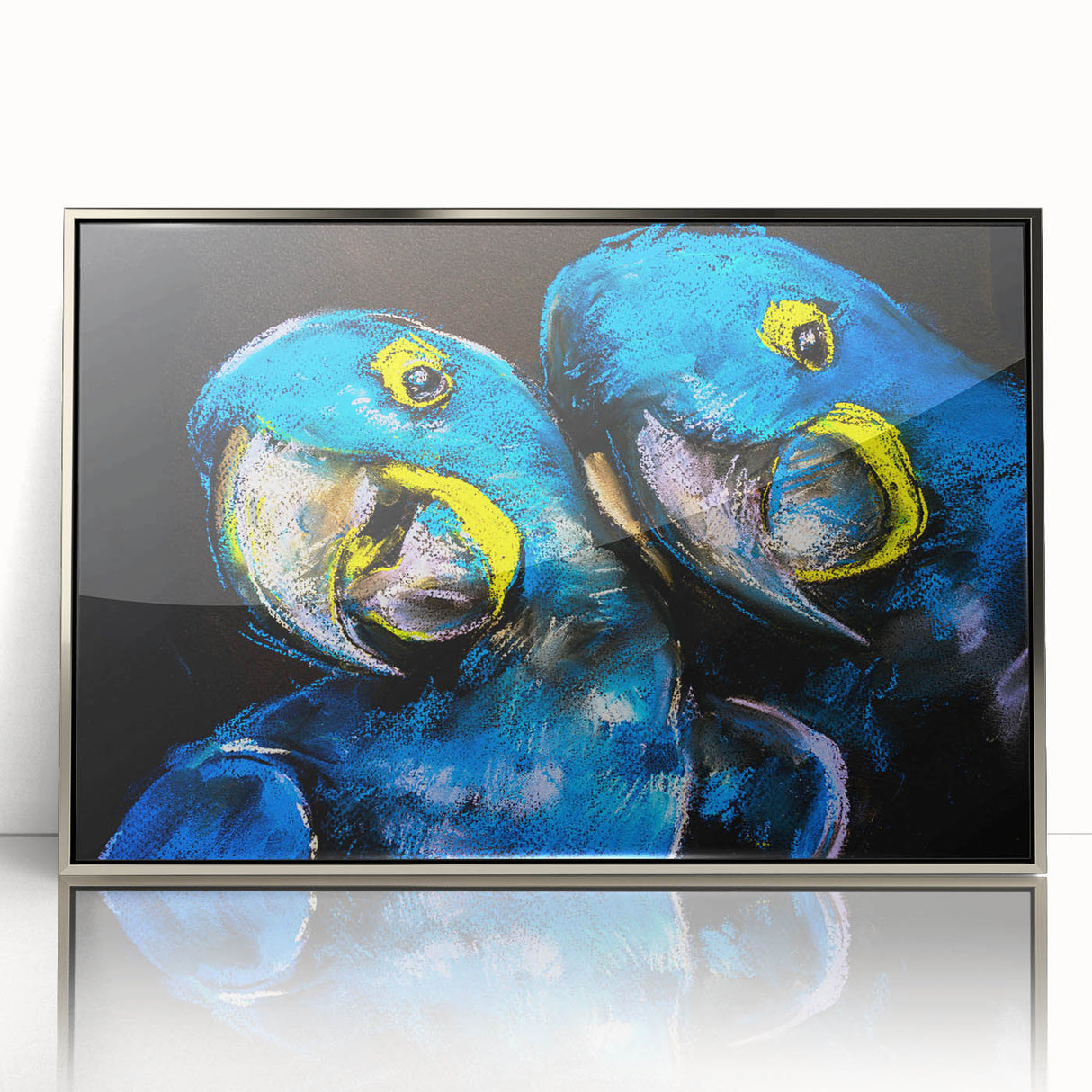 Framed wall art featuring a vibrant design of colorful parrots perched on branches, with a sleek silver frame, perfect for enhancing home decor.