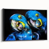Framed canvas wall art showcasing a vibrant design of colorful parrots against a black background, highlighting intricate details and textures for decorative appeal.