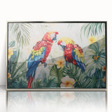 Framed wall art showcasing a vibrant collection of colorful parrots on a silver background, designed to enhance any living space with its eye-catching aesthetics and lively detail.