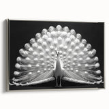 Framed canvas wall art showcasing a vibrant peacock design, featuring intricate details in shades of blue and green, displayed in a sleek silver frame, perfect for home decor.