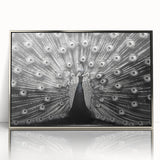 Framed wall art featuring a stunning peacock design in vibrant colors, displayed with a sleek silver frame, perfect for adding elegance to home décor.