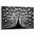Framed canvas wall art showcasing a vibrant peacock design with intricate detailing, set against a sleek black frame, ideal for modern home decor.