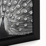 Close-up of a vibrant, framed canvas featuring a peacock design, showcasing intricate feather details and rich colors, perfect for enhancing home decor.