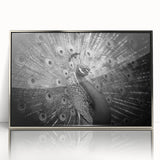 Framed wall art featuring an elegant peacock design in vibrant colors, with a sleek silver frame, perfect for adding a touch of sophistication to any decor.