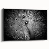 Framed canvas wall art featuring a vibrant peacock design with intricate detailing, set against a black background, showcasing a stylish side view for contemporary decor.