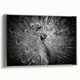 Framed wall art featuring an elegant peacock design on textured canvas, showcasing vibrant colors and intricate details, set against a silver frame. Ideal for enhancing modern decor.