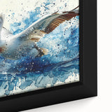 Close-up of a framed canvas wall art featuring a colorful pelican design, showcasing vibrant hues of blue and orange, perfect for coastal home decor.