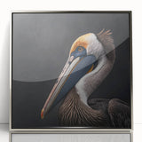 Framed acrylic wall art featuring a striking pelican design against a silver background, showcasing vibrant colors and intricate details, perfect for home decor.