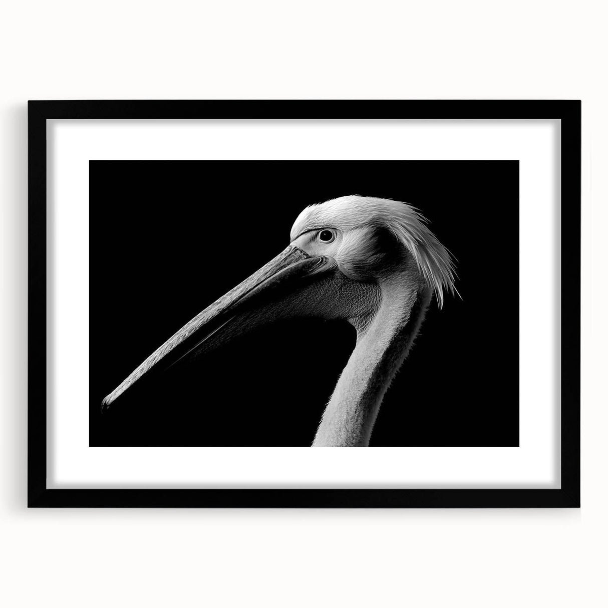 Framed wall art featuring a striking black pelican design with a white background, showcasing a contemporary aesthetic ideal for modern home decor.