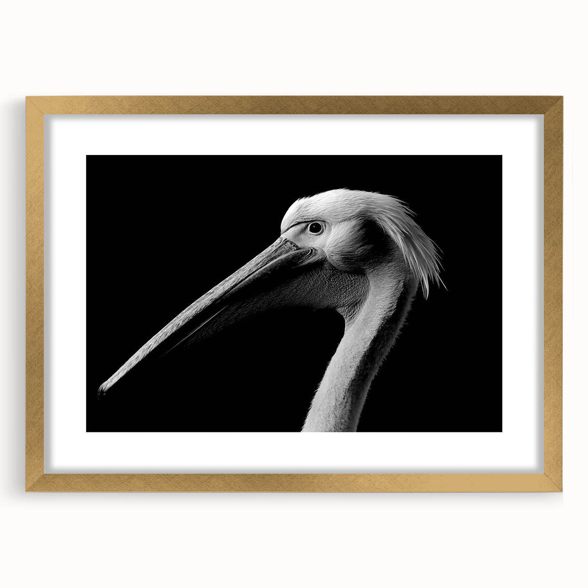 Framed wall art featuring an elegant pelican design in gold, showcasing intricate details and a stylish mat. Perfect for enhancing home decor in coastal-themed spaces.