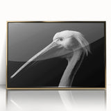 Framed acrylic wall art showcasing a gold-accented pelican design, ideal for coastal decor, enhancing any living space with its elegant front view.