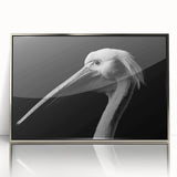 Framed acrylic wall art featuring a silver front view of a pelican design, showcasing intricate details and vibrant colors, perfect for coastal home decor.