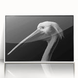 Framed acrylic wall art featuring a stylized pelican design on a white background, ideal for coastal-themed decor, enhancing living spaces with a touch of nature.
