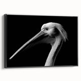 Framed canvas wall art featuring a side view of a stylized pelican design in black, perfect for enhancing modern home decor with a touch of elegance.