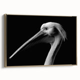 Framed wall art featuring a side view of a golden pelican design on a textured canvas, set against a sleek, modern background for elegant home decor.