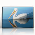 Framed wall art featuring a pelican design, showcasing vibrant colors and intricate details, set in a sleek black frame, perfect for coastal decor.