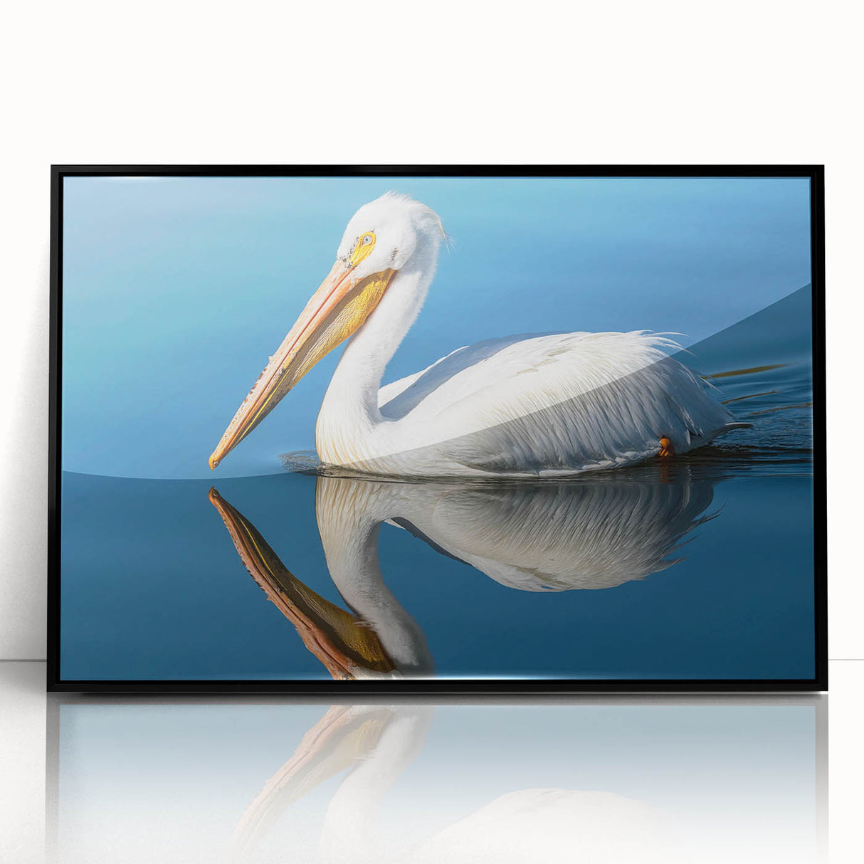 Framed wall art featuring a pelican design, showcasing vibrant colors and intricate details, set in a sleek black frame, perfect for coastal decor.