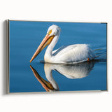 Framed wall art showcasing a silver pelican design on canvas, highlighted with intricate details and textures, perfect for enhancing modern home decor.