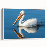 Framed canvas wall art featuring a side view of a pelican design, showcasing vibrant colors and intricate details, perfect for coastal-themed decor.