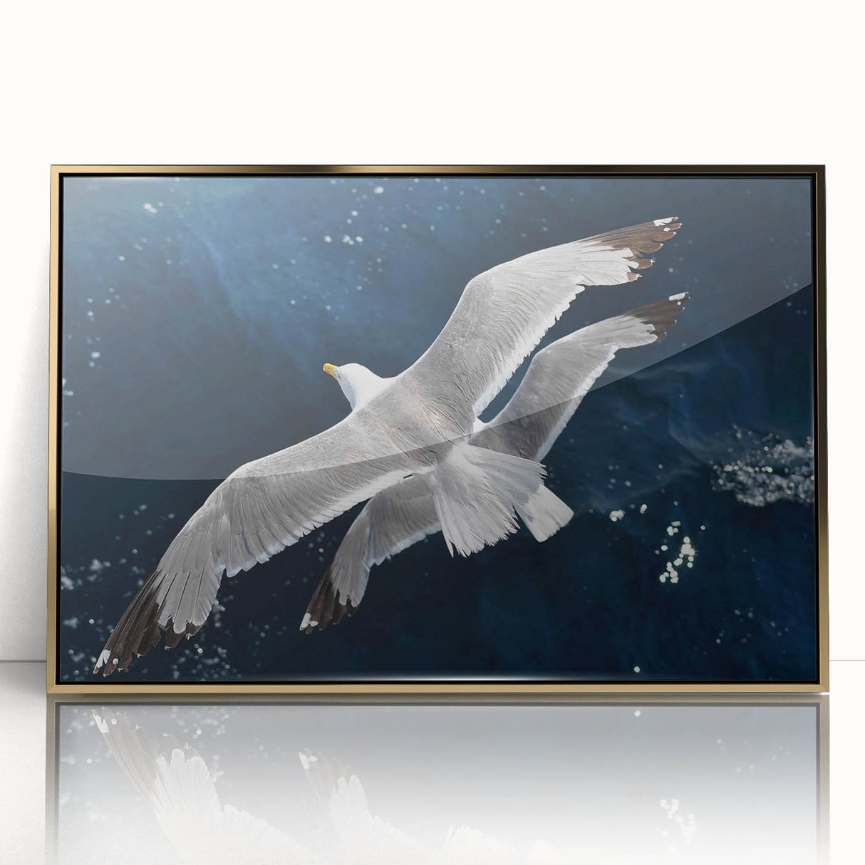 Framed wall art featuring a vibrant sea birds design in acrylic with a gold frame, showcasing various birds in flight against a serene blue background. Ideal for coastal-themed decor.
