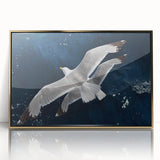 Framed wall art featuring a vibrant sea birds design in acrylic with a gold frame, showcasing various birds in flight against a serene blue background. Ideal for coastal-themed decor.