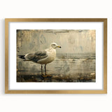 Framed wall art collection featuring elegant sea bird designs in gold and blue tones, perfect for coastal home decor, showcased with a mat for added sophistication.