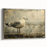 Framed canvas wall art showcasing a serene sea bird design, featuring soft blue tones and silver accents, ideal for coastal-themed home decor.