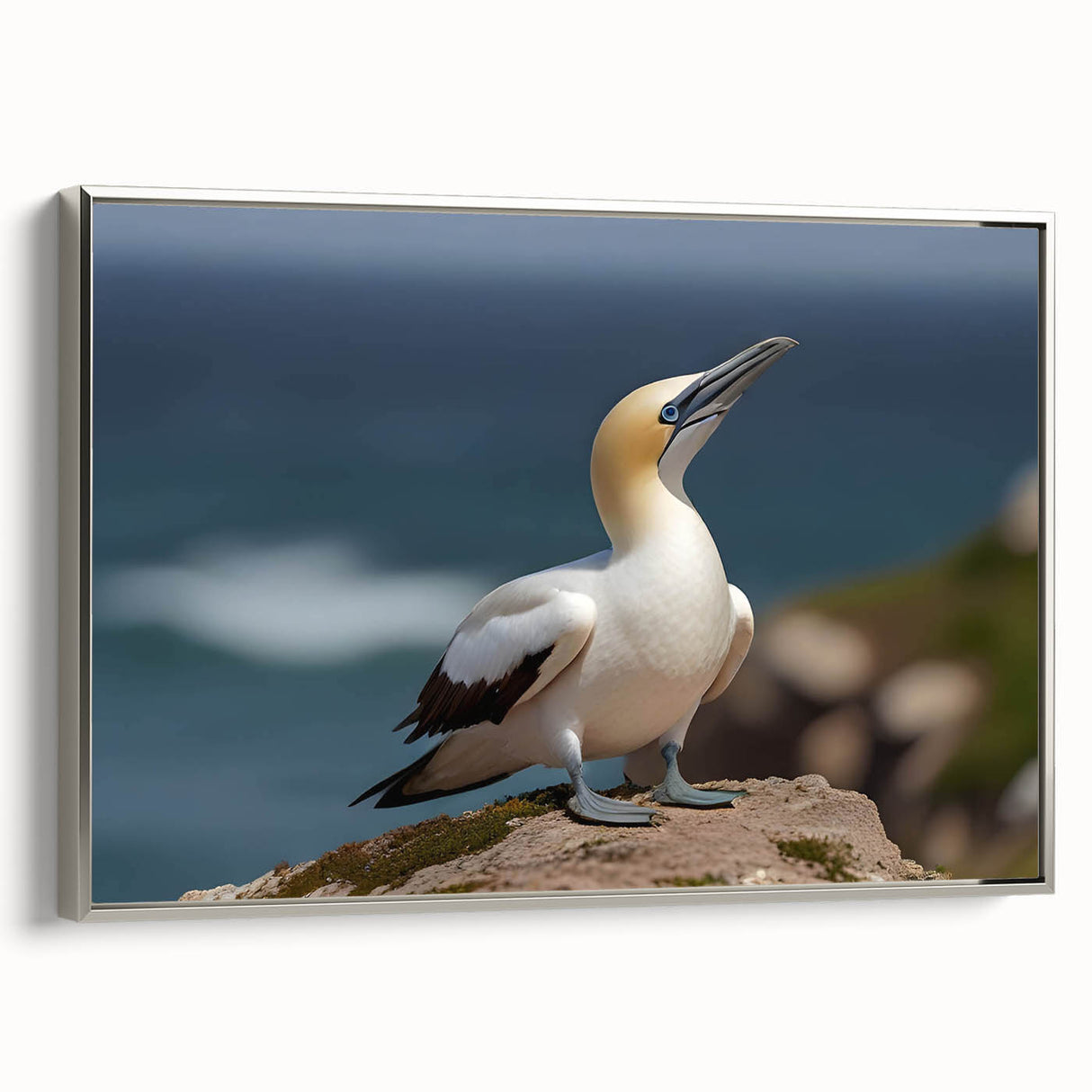 Framed canvas wall art showcasing a serene sea bird design in silver tones, perfect for coastal decor. Ideal for adding a touch of elegance to living spaces.
