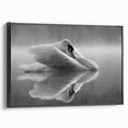 Framed wall art featuring a serene swan design in a black canvas, showcasing elegant lines and soft colors, perfect for home decor in a modern setting.