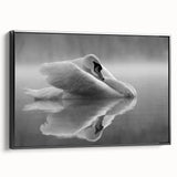 Framed wall art featuring a serene swan design in a black canvas, showcasing elegant lines and soft colors, perfect for home decor in a modern setting.