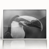 Framed wall art featuring a vibrant tropical bird design in a white frame, showcasing colorful parrots and lush foliage, perfect for enhancing home decor.