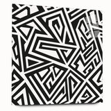 Abstract black and white wall art design displayed in an acrylic glass frame, showcasing fluid shapes and textures for modern decor.