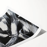 Abstract black and white rolled wall art print showcasing dynamic geometric shapes, perfect for modern decor and artistic expressions.