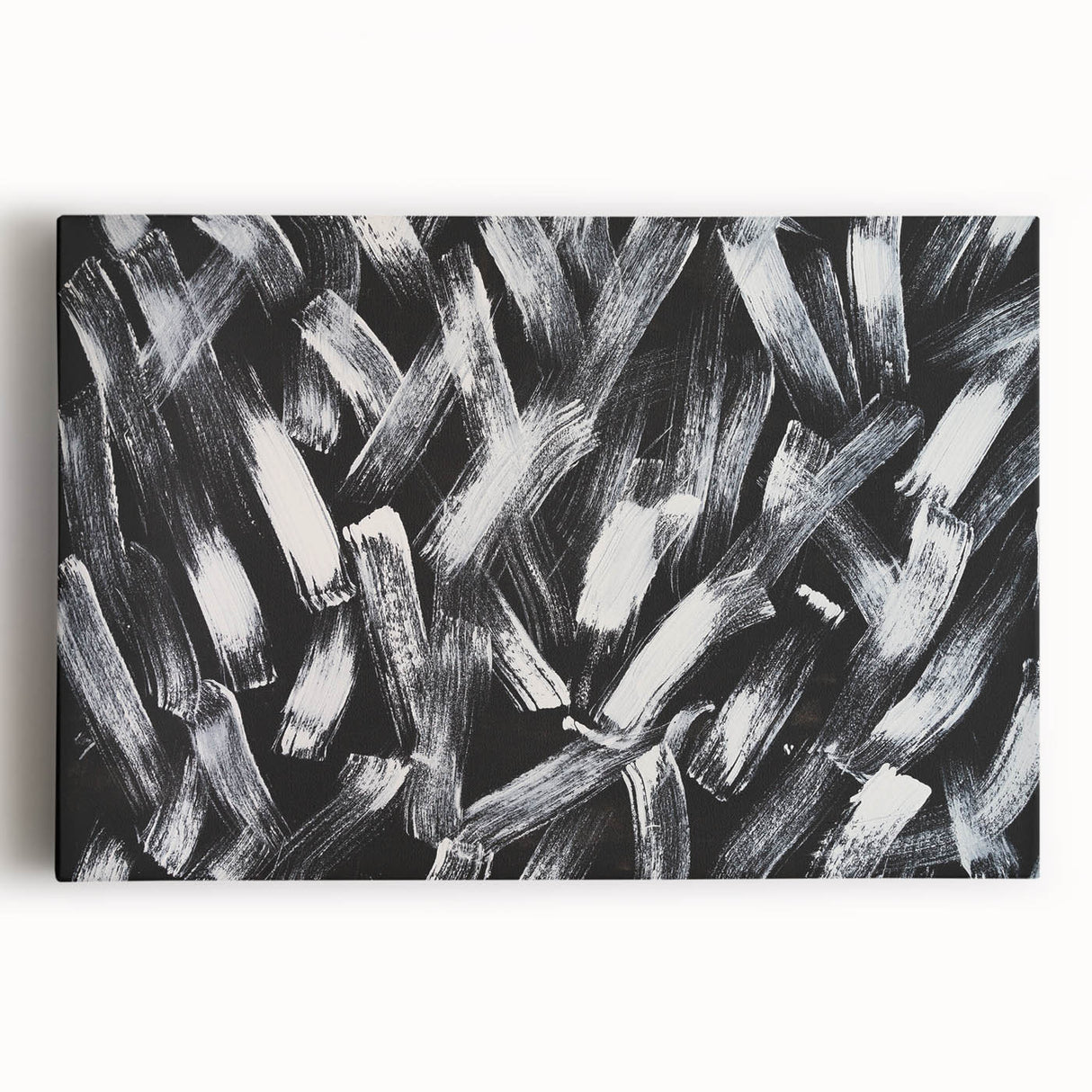 Abstract black and white stretched canvas wall art showcasing a modern geometric design, perfect for contemporary home decor.