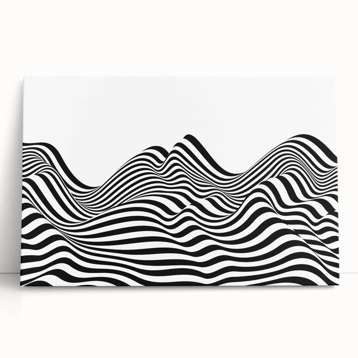 Abstract black and white stretched canvas wall art leaning against a wall, showcasing dynamic shapes and textures for modern decor.