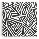 Abstract black and white stretched canvas wall art showcasing a modern design with bold geometric shapes and patterns, perfect for contemporary decor.