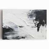 Abstract black and white wall art collection displayed on stretched canvas, showcasing bold geometric shapes and fluid designs for modern decor.
