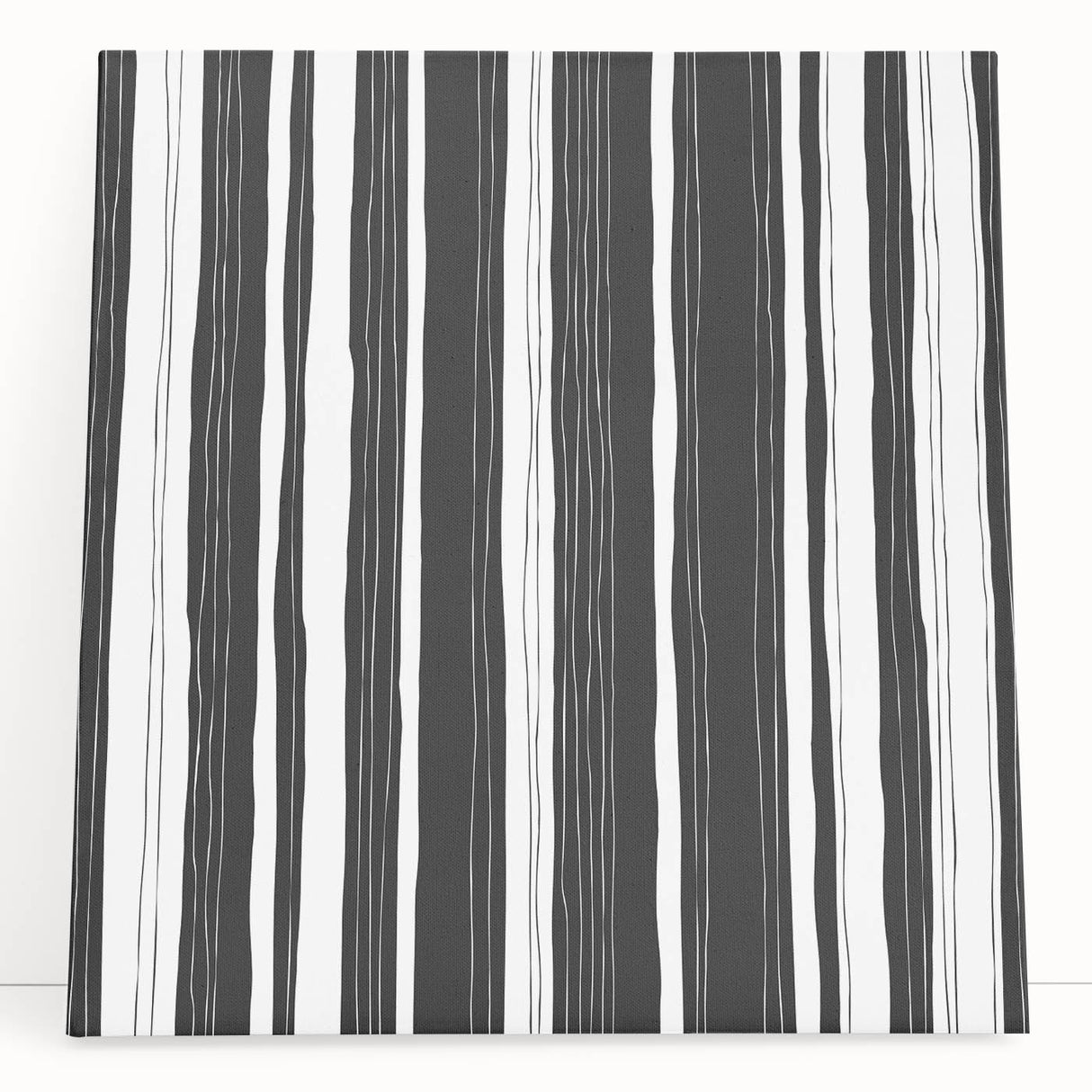 Abstract black and white stretched canvas wall art showcasing a modern geometric design, perfect for contemporary home decor or office spaces.