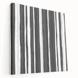 Abstract black and white wall art collection on stretched canvas, showcasing modern geometric patterns and textures in a side view perspective.