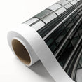 Black and white abstract art deco design on rolled canvas, featuring geometric shapes.