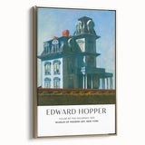 Framed canvas with a vintage-inspired Edward Hopper landscape painting in muted gold and black tones.