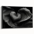 Abstract geometric framed canvas artwork showcasing a sleek black design with vibrant accents, viewed from the side. Ideal for modern home decor or office spaces.