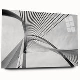 Large abstract wall art on acrylic glass, featuring swirling gray and blue tones, ideal for bedroom or dining room decor.