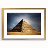 Textured abstract art print of an Egyptian landscape in gold and earth tones on a framed canvas, suitable for bedroom decor.