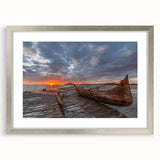 Abstract art print of a Madagascar scenery in muted earth tones, framed in silver, ideal for dining room decor.