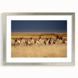 Textured art print of an abstract Namibian landscape in earth tones, framed in silver, ideal for bedroom art.