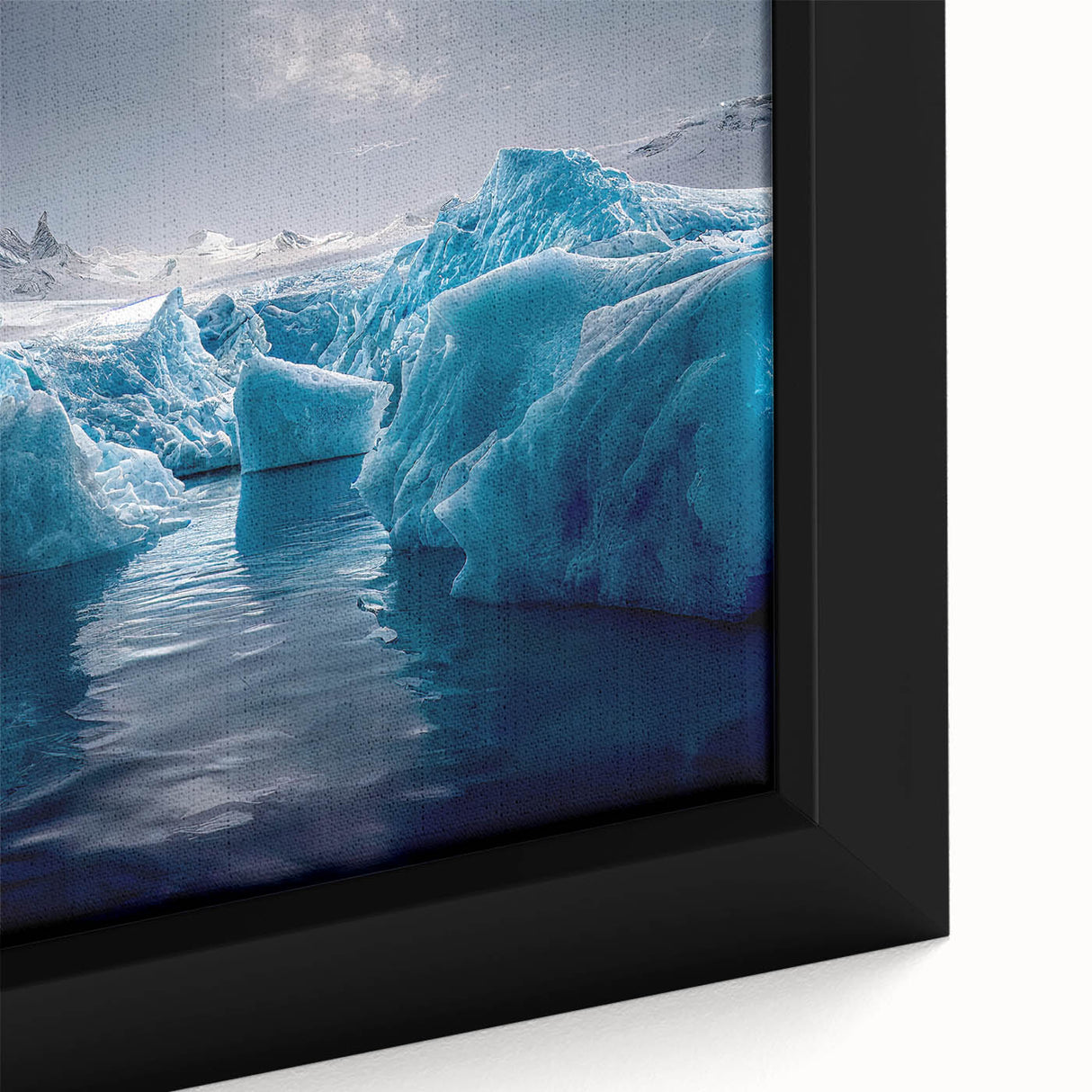 Close-up of a textured, black wall art featuring a colorful Antarctic scenery on a framed canvas.