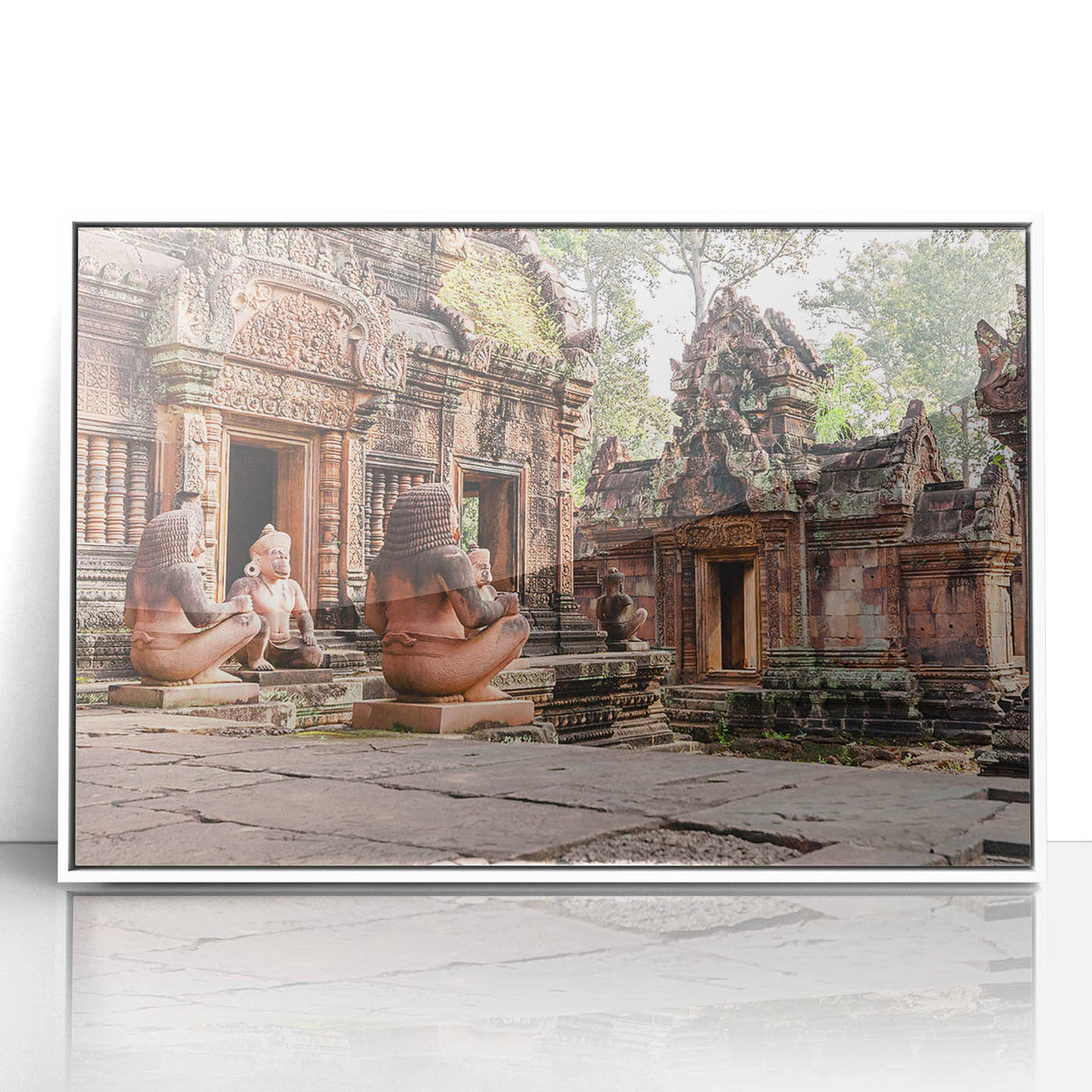 Acrylic print of a serene Cambodian landscape in muted green and blue tones, framed in white.