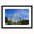 Extra large abstract art print featuring colorful, textured imagery of a Malaysian landscape, framed in black.